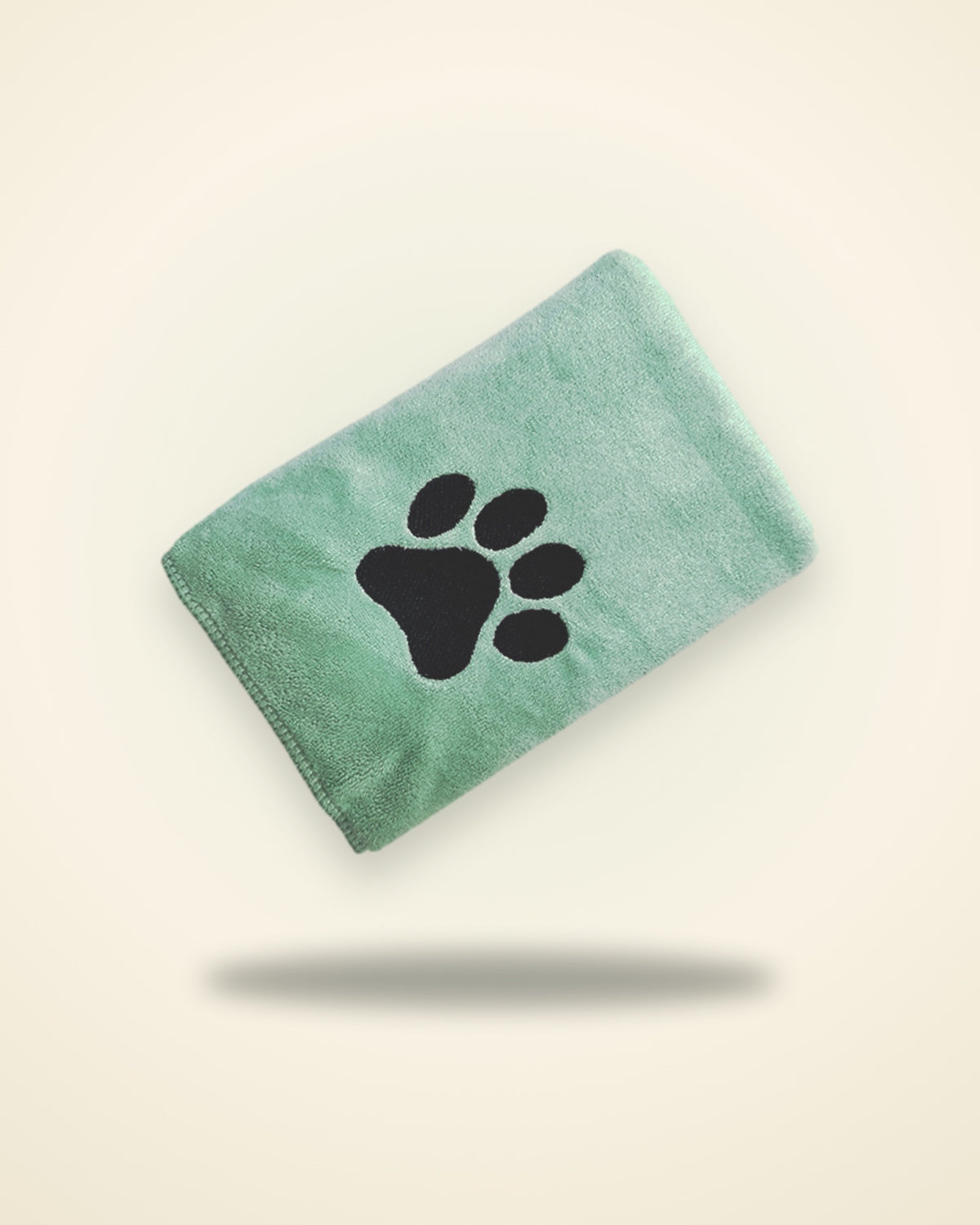 Folded sage microfibre towel with a black embroidered paw